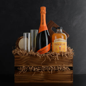 Mother's Day Gift Basket, includes prosecco, bellini mixer, champagne flutes, coasters, and cutting board. Great Mother's Day gift idea.